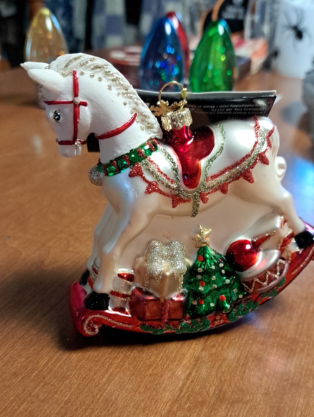 Festive White Rocking Horse Ornament with Red and Green Accents